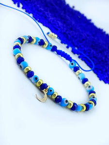 Pulsera con Ojo turco Cristales y checas doradas hecho a mano con dije en forma de Luna good luck